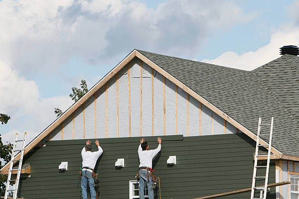 Professional Siding Installation technician working in Oak Park, IL